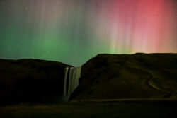 Colorful aurora rays behind Skogafoss 2 dsc 7041 remastered topaz gigapixel 4x