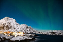 Village of Svolvaer, Norway with faint aurora arc and full moon 4 dsc 2665
