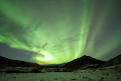 Classic 'hurricane-curl' formation with 'outflow' aurora formation above snowfields 6 dsc 3687